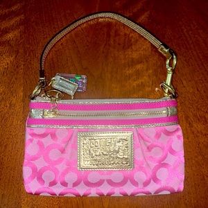 Pink and gold rare vintage Coach wristlet.